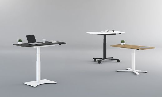 Modelo Griego - Mesa de trabajo regulable con ajuste electrico. Tablero de madera en color natural y estructura en color blanco. Dispone de ruedas con freno.